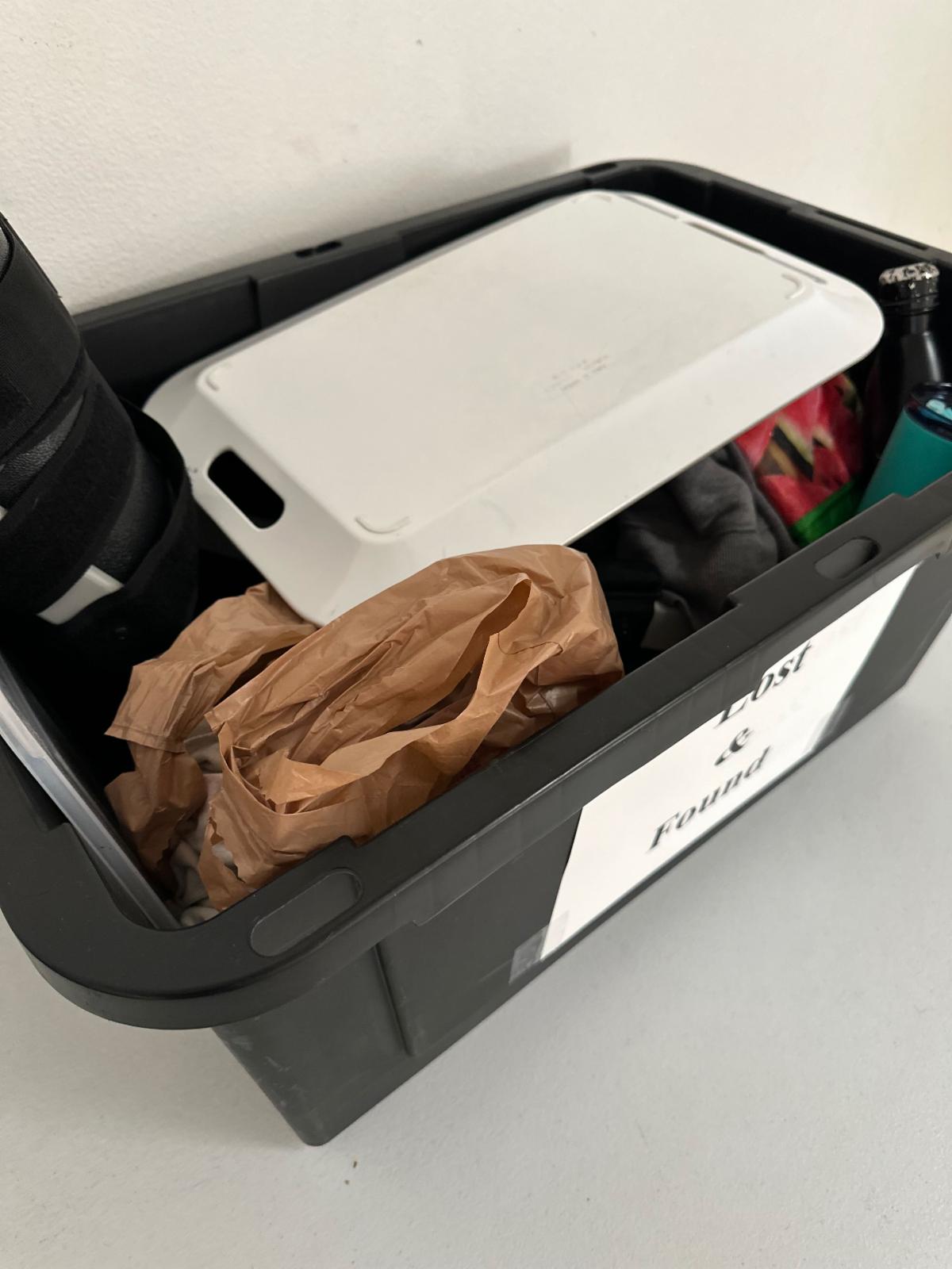 encouraging everyone to get their lost items from the lost and found box