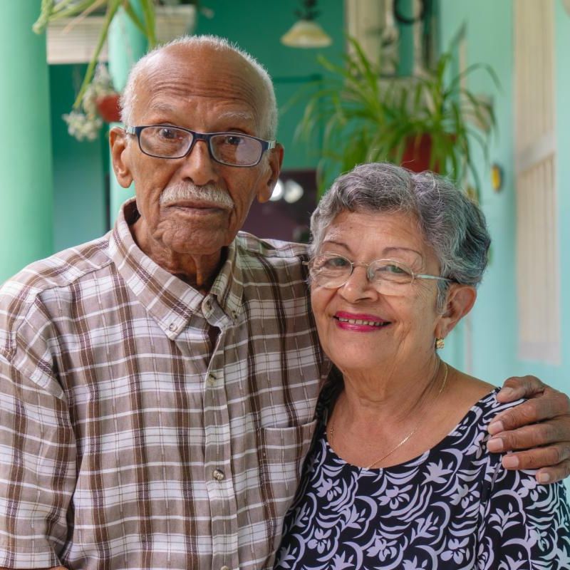 An older couple standing together.
