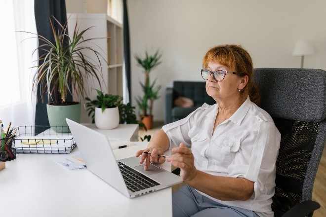 Person sitting with laptop