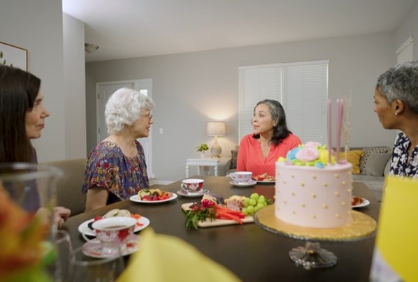 A group of women sitting at a table. 
