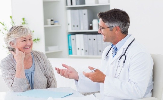 A doctor talking to an older person