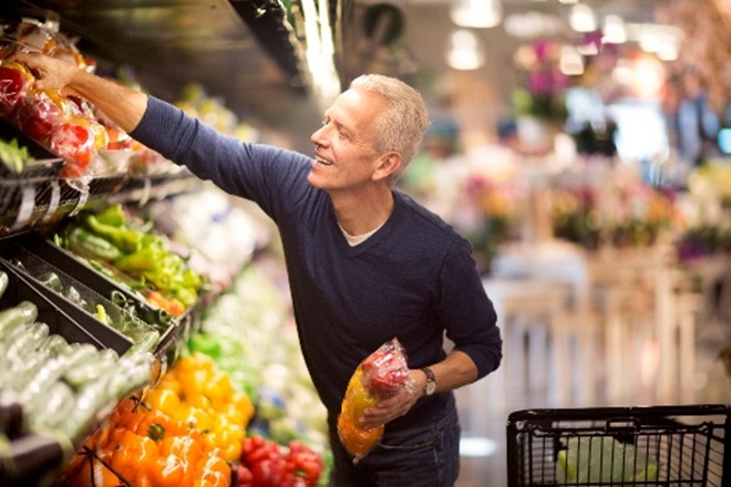 Elderly man grocery shopping