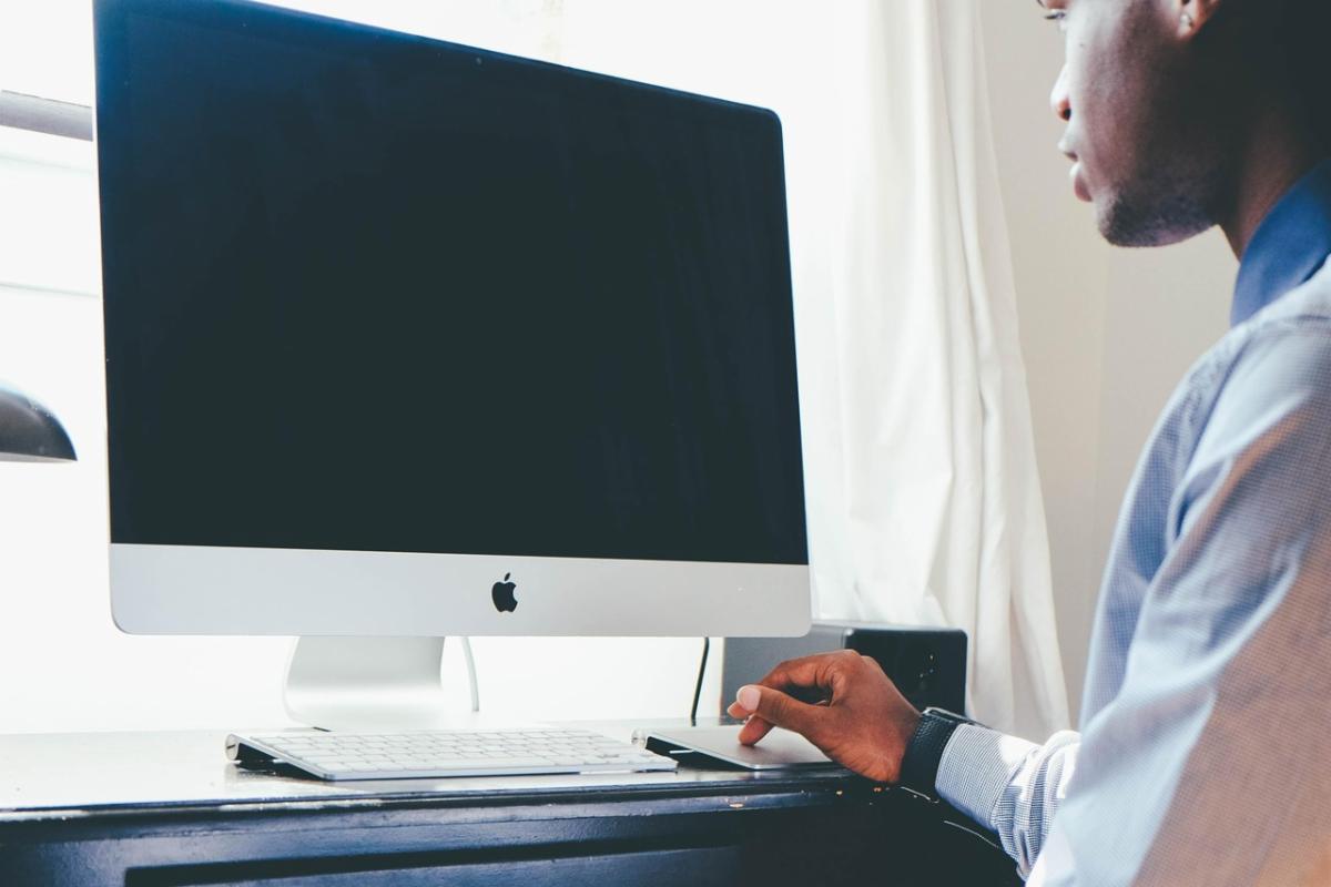 student working at a desktop computer