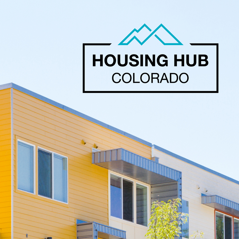 A yellow building with the Housing Hub Colorado word mark.