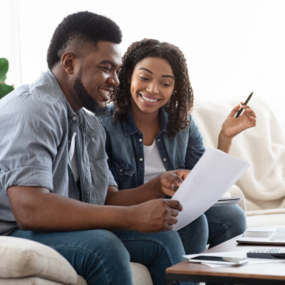 Two people reading and smiling