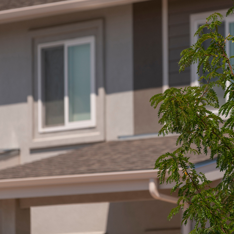 Photo of an exterior window on an upper floor of a multifamily building