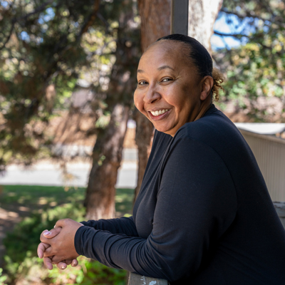 A woman smiling outdoors