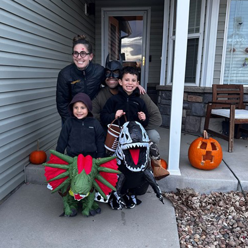 A family on their porch on Halloween