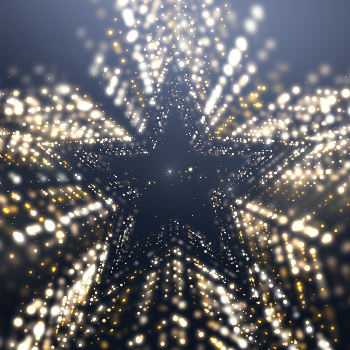 A black star in the center surrounded by gold light