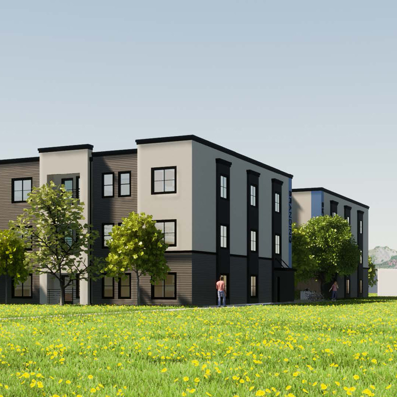 A rendering of a multifamily building on a green lawn