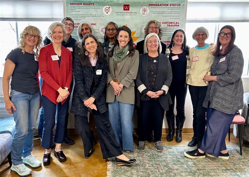 Group of Women Pose for a photo in NMW.O office from our first Communities of Care Gathering