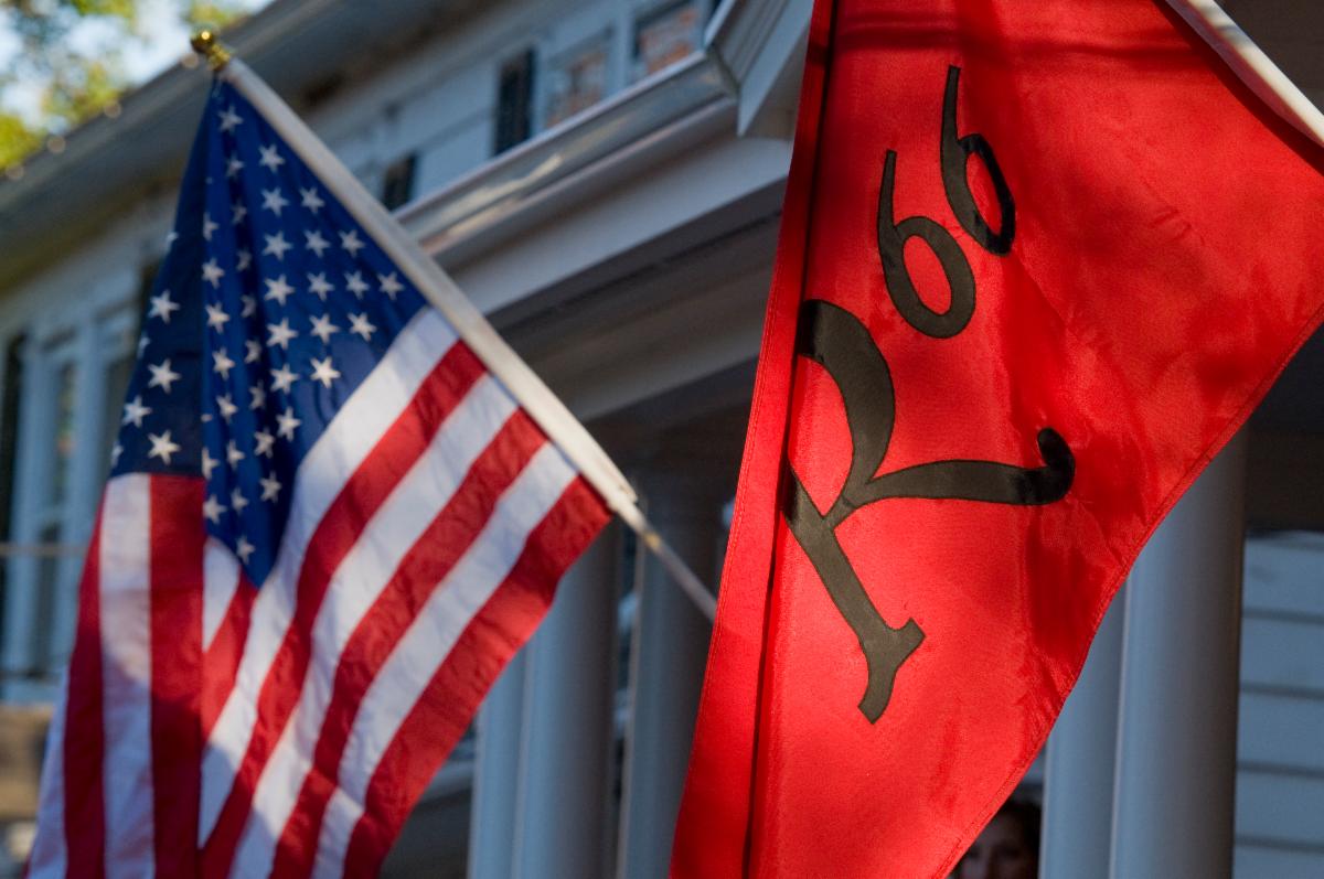 American flag flies next to a Rutgers 1766 flag