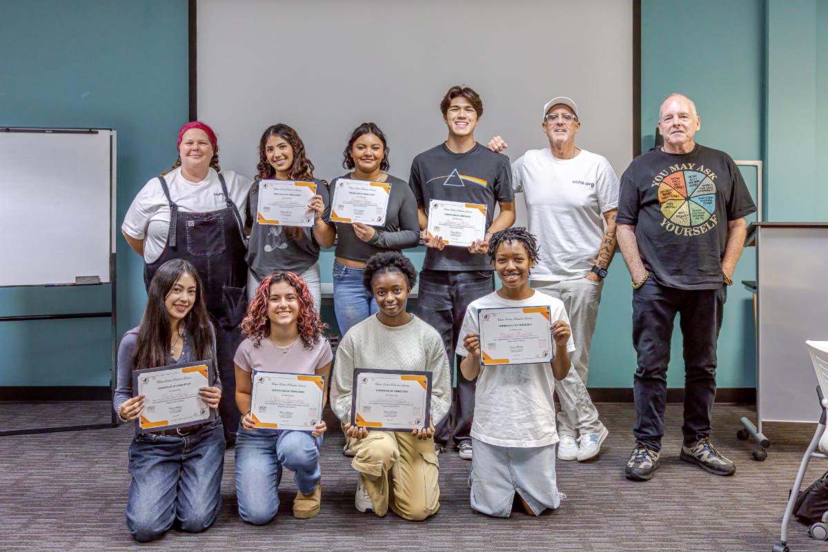 a group of youngsters holding certificates 