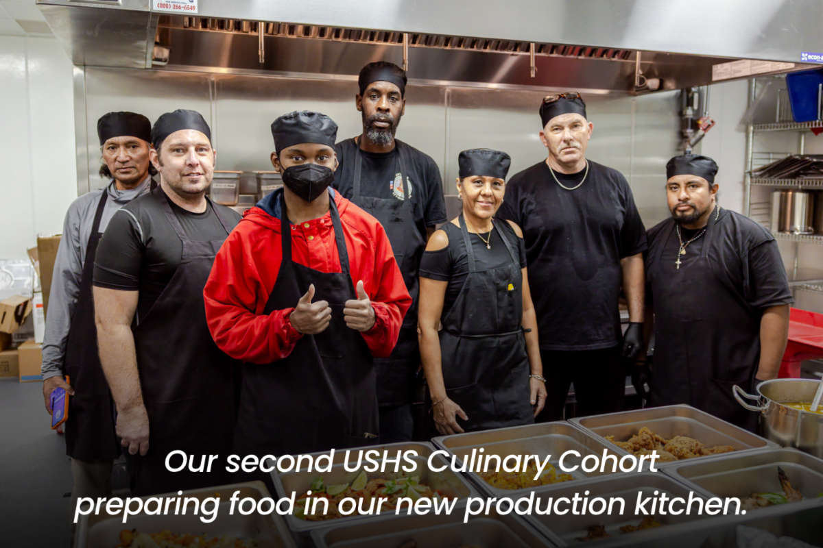 a group of people in a food kitchen 