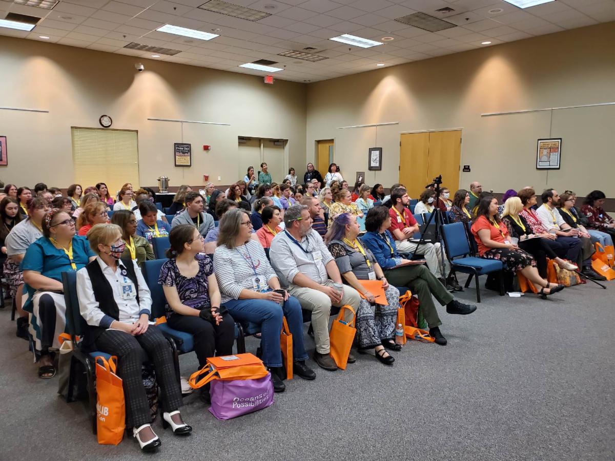 Image of a group of librarians listening to a presentation at the KidsLib MiniCon in 2023