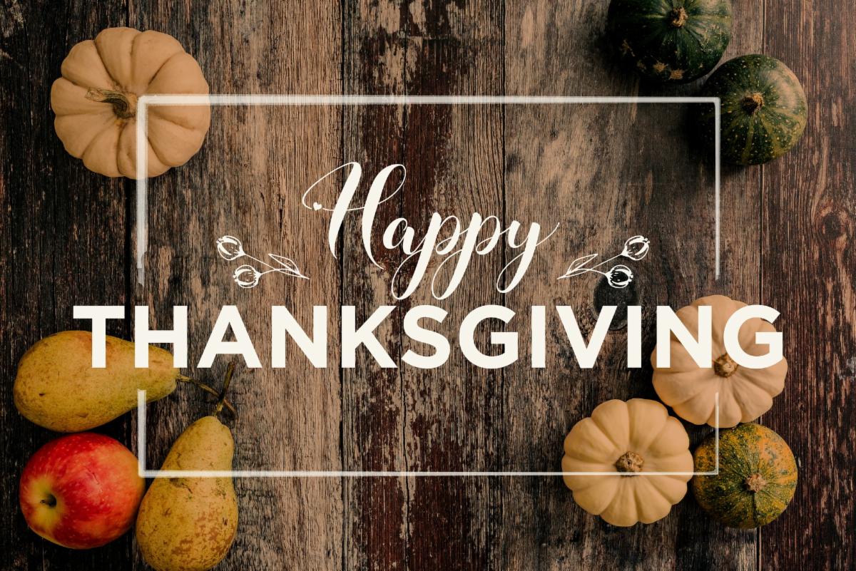 Happy Thanksgiving Day with pumpkin and nut on wooden table