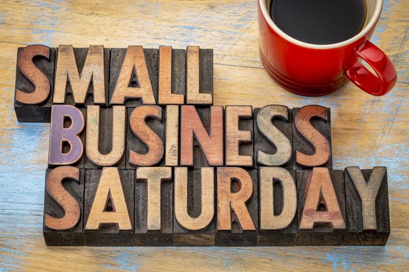 Small Business Saturday word abstract - text in vintage letterpress wood type with a cup of coffee_ holiday shopping concept