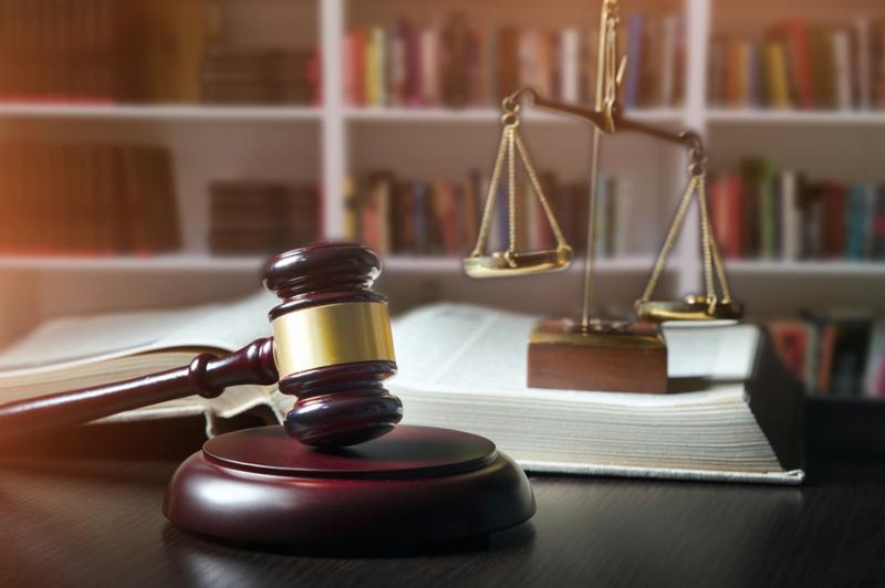 Gavel in court room library. law attorney legal legality weight scales background gavel concept