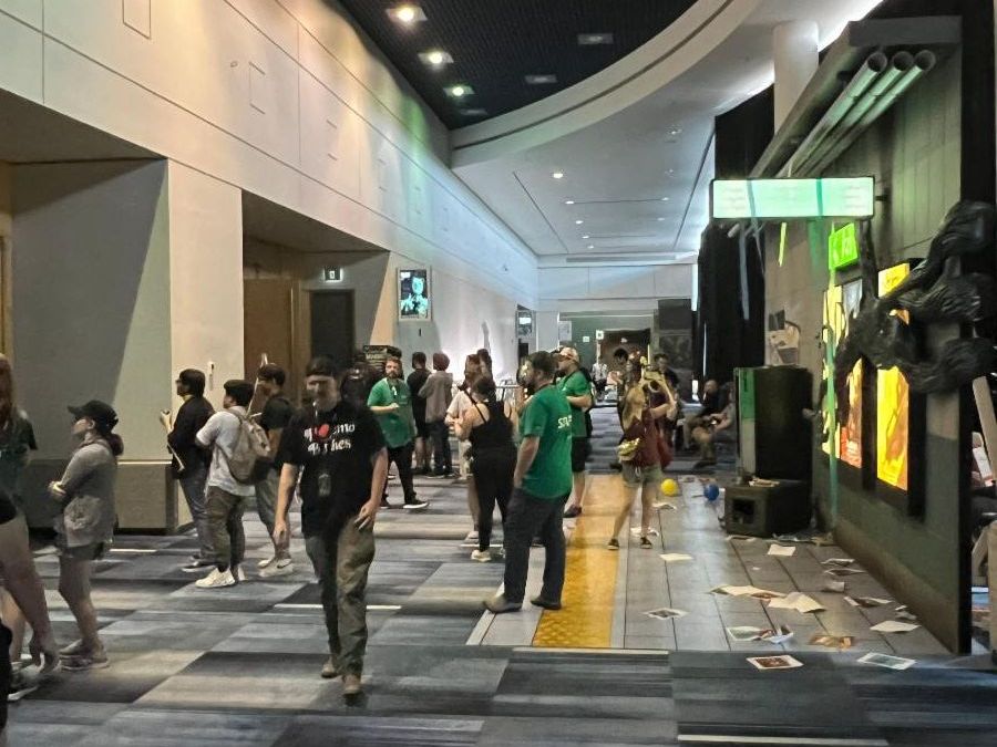 Guests at TennCon walk near life size WARFRAME decorations in RBC Place London.