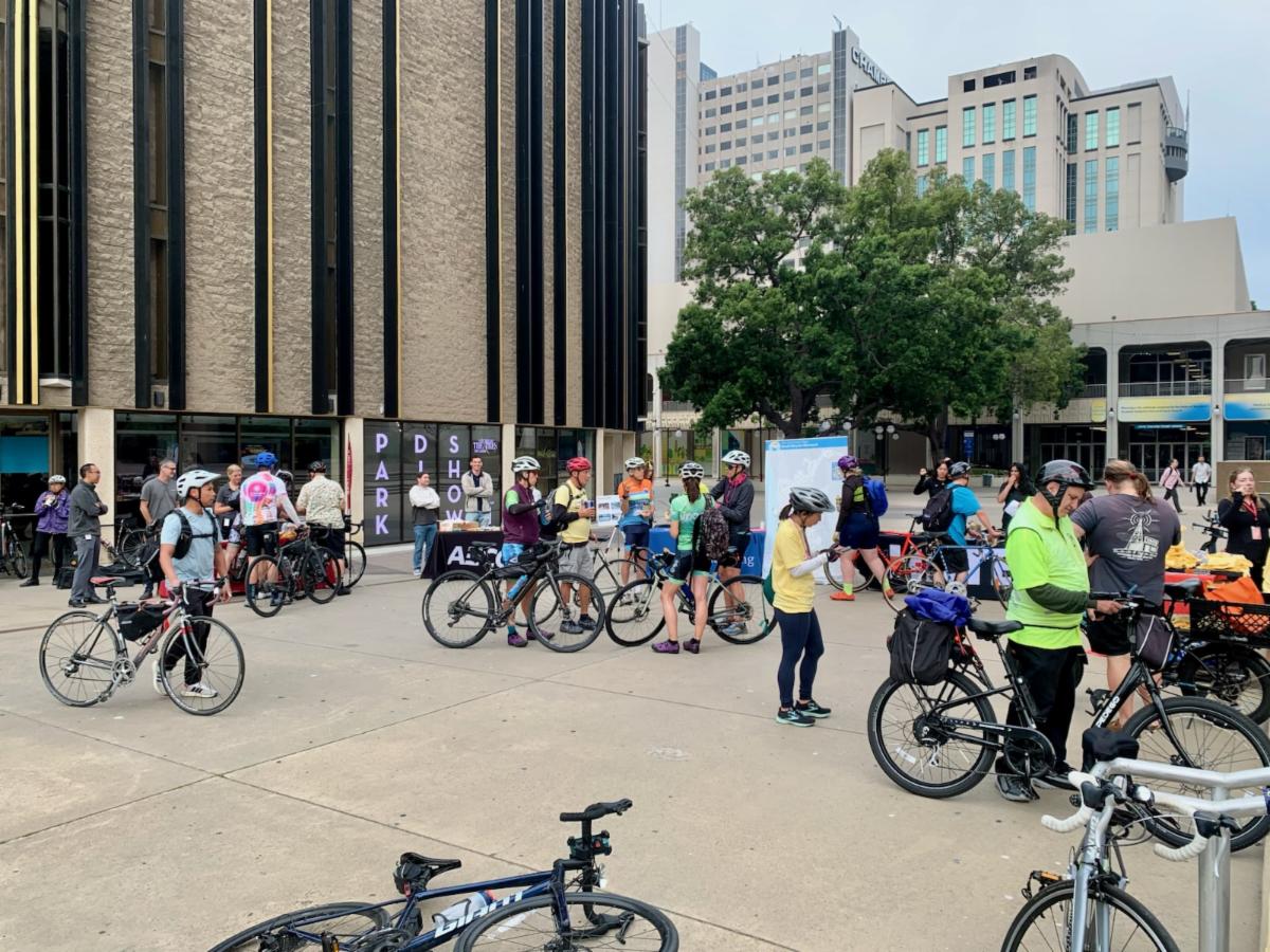 Crowds of bike-riders congregate in Civic Center Plaza for Bike Anywhere Day