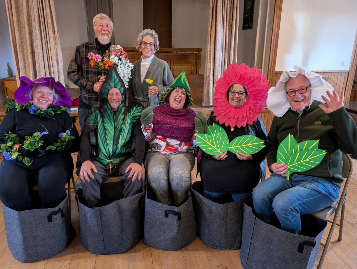 The cast and crew of Late Bloomers dressed in their flower and flowerpot costumes.