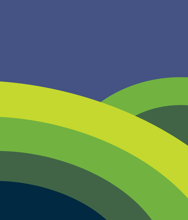 Two rolling hills in different shades of green beneath a blue sky.