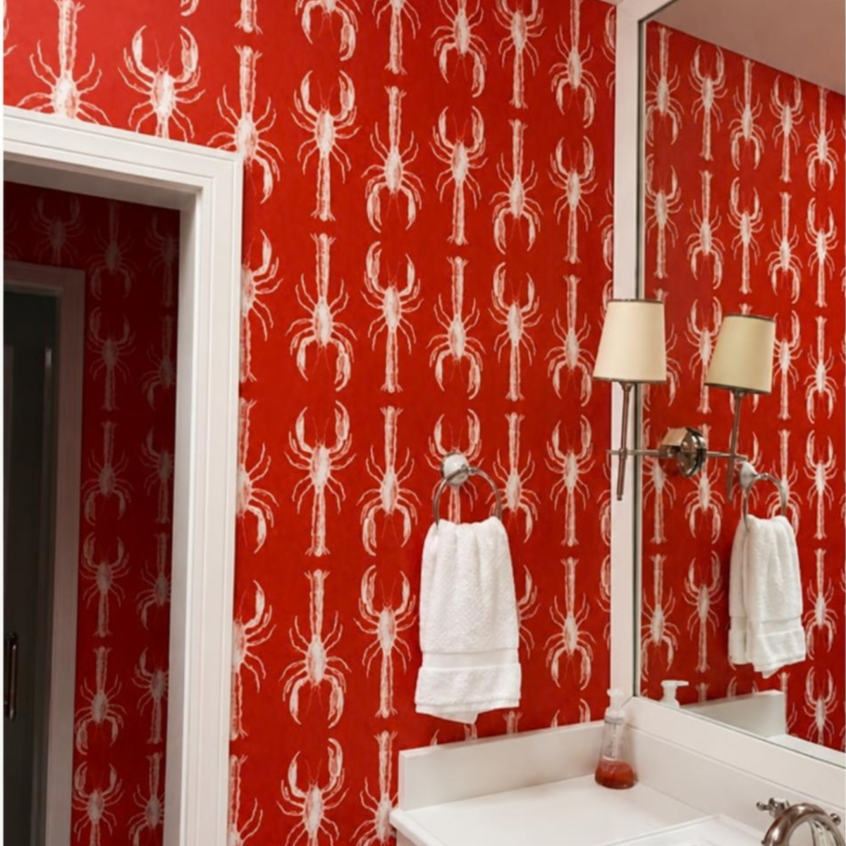 Red and white lobster print powder room wallpaper installed by D&D Decorators