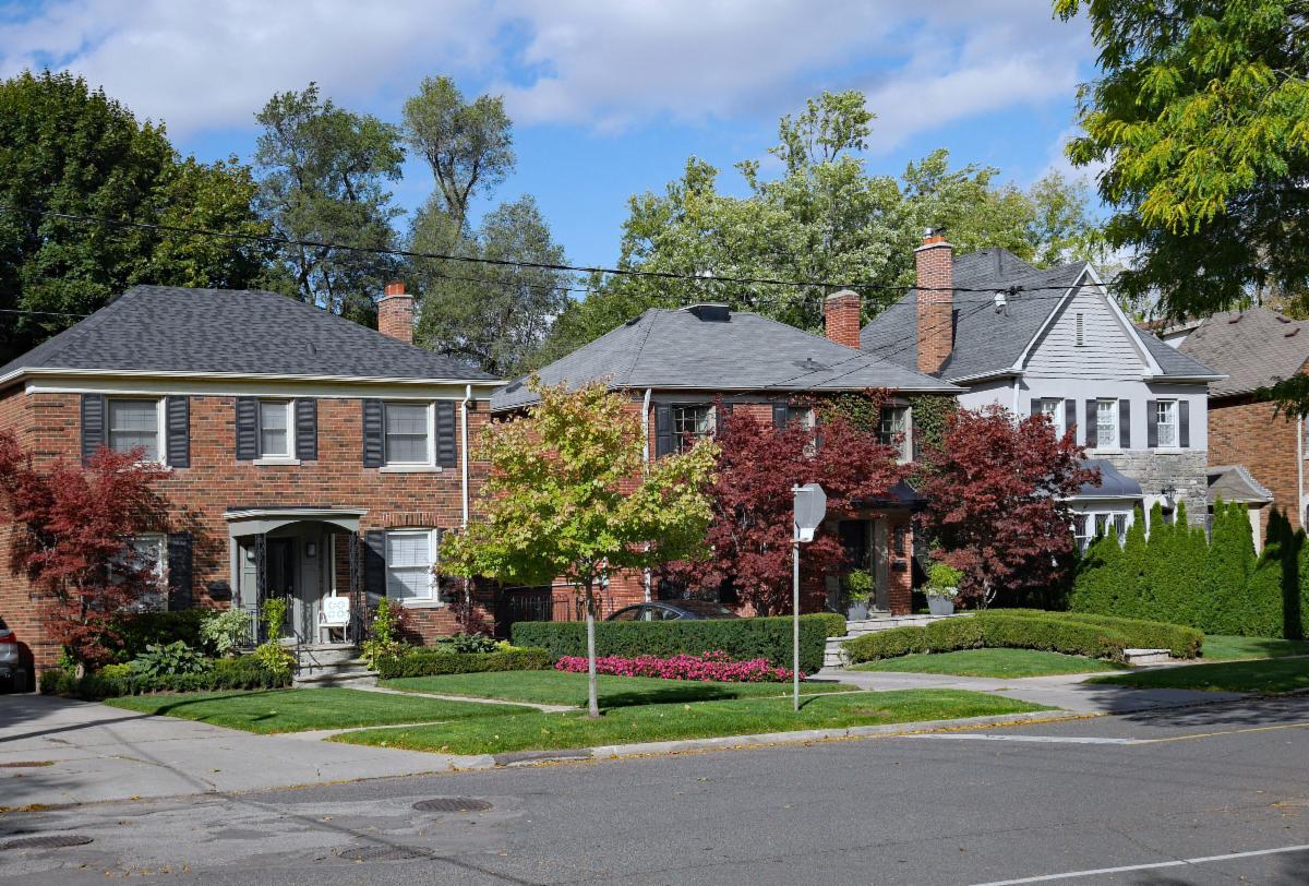 Suburban street with older brick detached houses