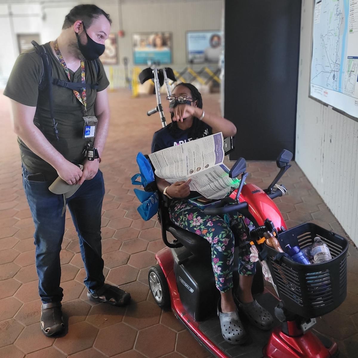 Program and Training Coordinator Andrew Shaw travel training with Janeek Prince through her local metro station
