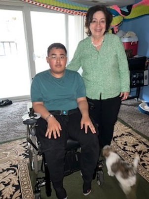 Rosalia Fajardo visited with a Latin teenage boy with muscular dystrophy
