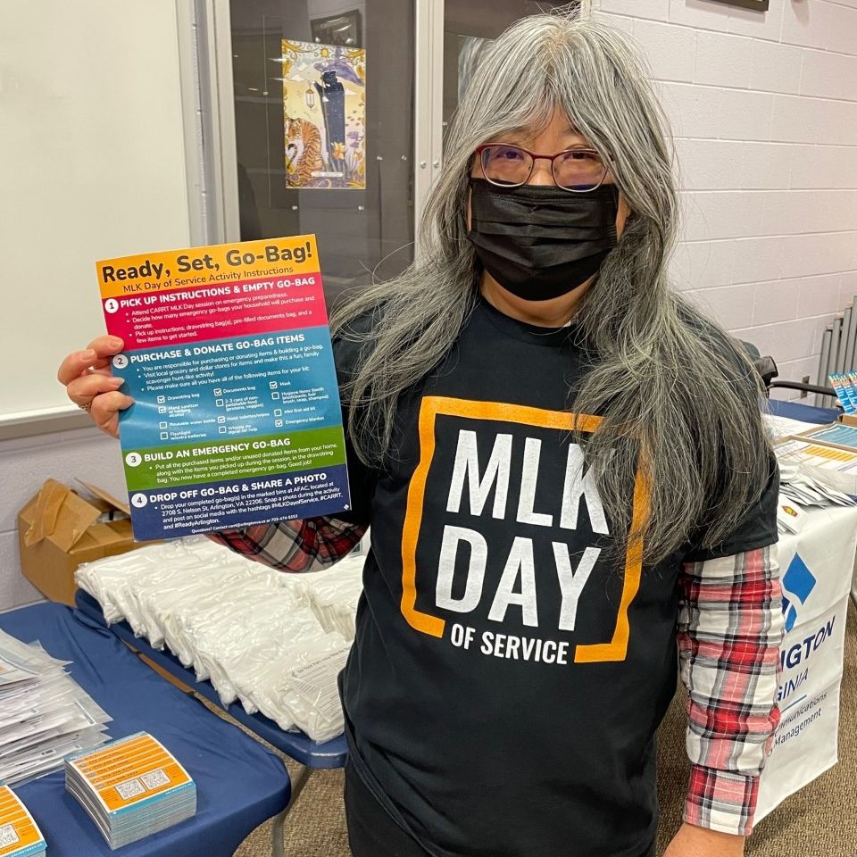 [Image: Cherie holding up instructions for preparing the bags].