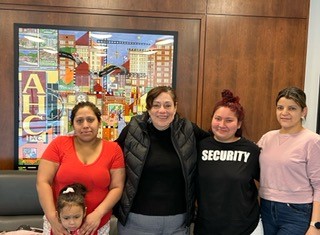 Rosalia with three Latina mothers at the Spire Apartments in Alexandria
