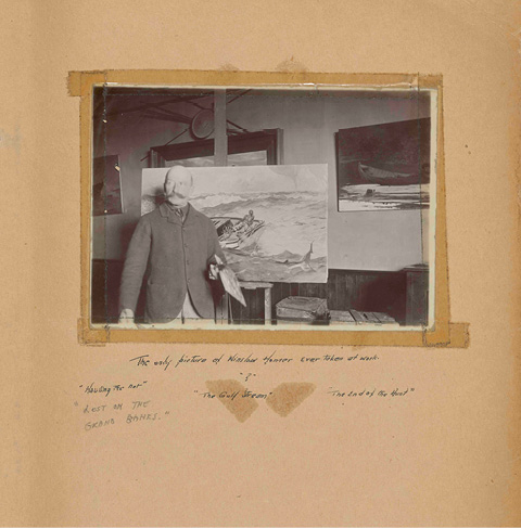 A page of a scrapbook featuring a black and white photo of artist Winslow Homer