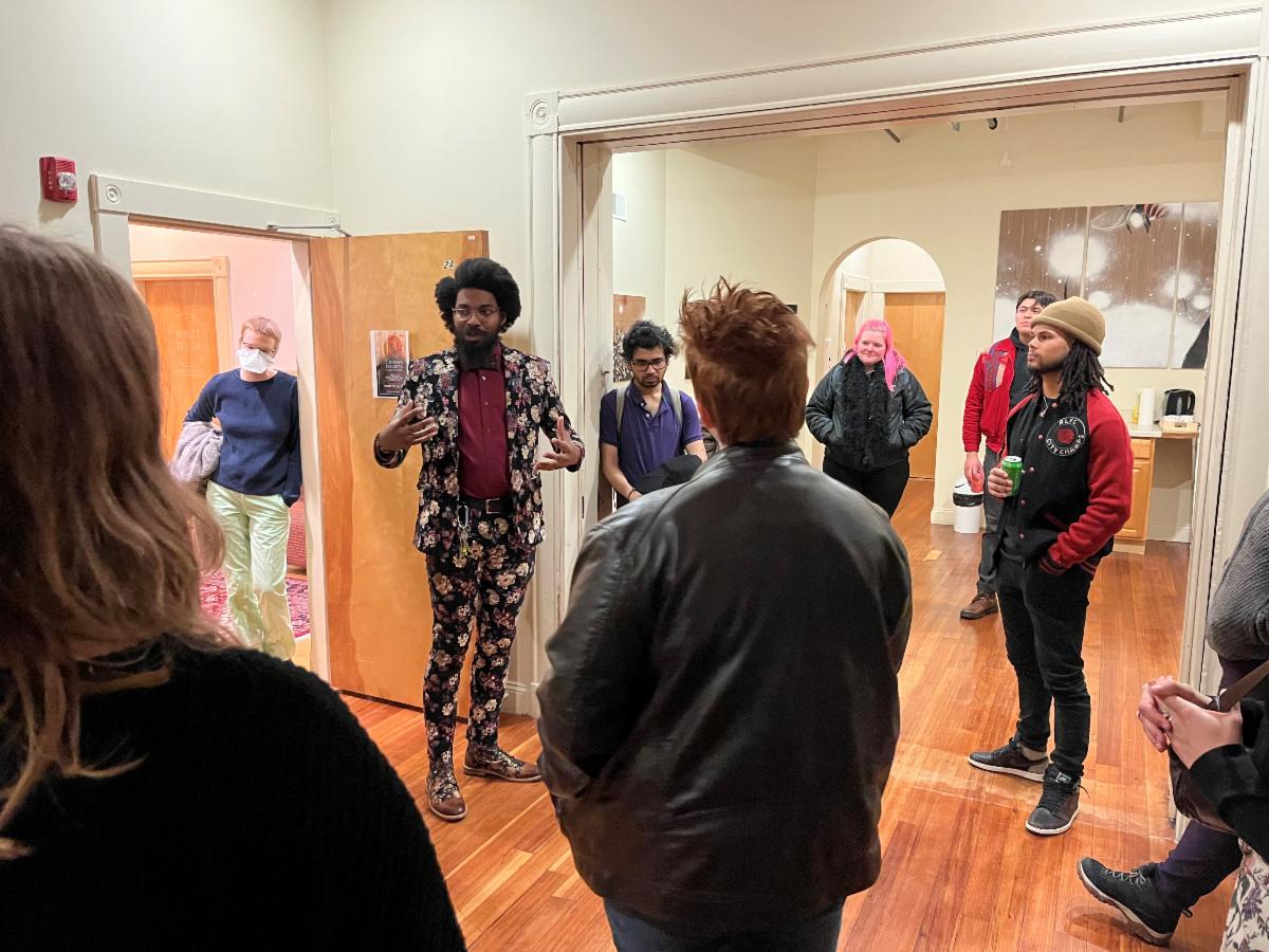 Artist Michael Talbot talks at his art exhibition in the BIPOC space at the Armory