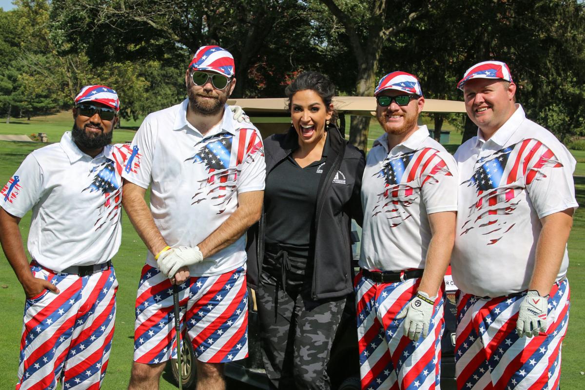 Fox 8's Kristi Capel with golfers at CHMF Golf Outing.