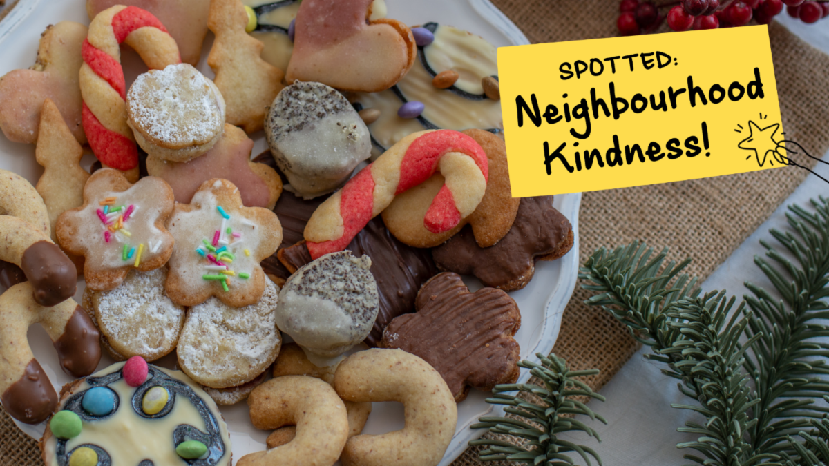 Assorted decorated christmas cookies with test reading spotted neighbourhood kindness