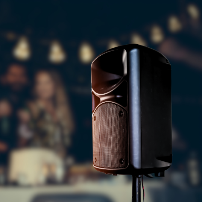 Large speaker with people in the background