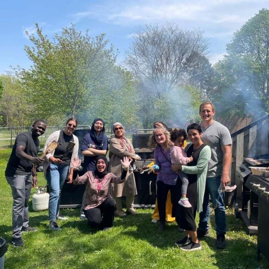 Group photo of various people outdoors