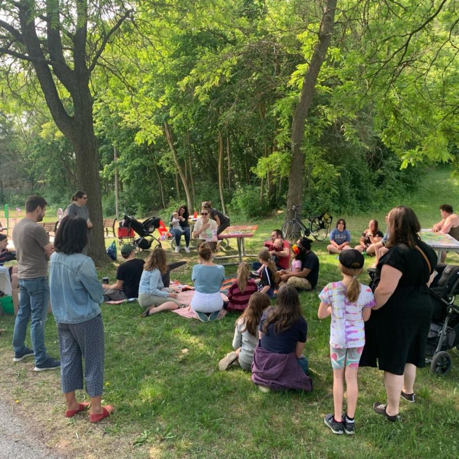 Group of people sitting outdoors in a park
