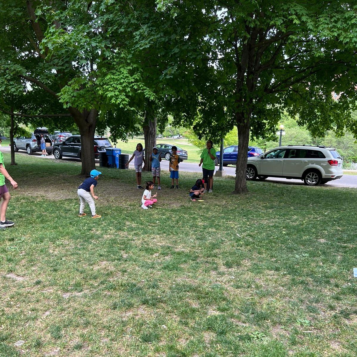 Kids of various ages playing in park