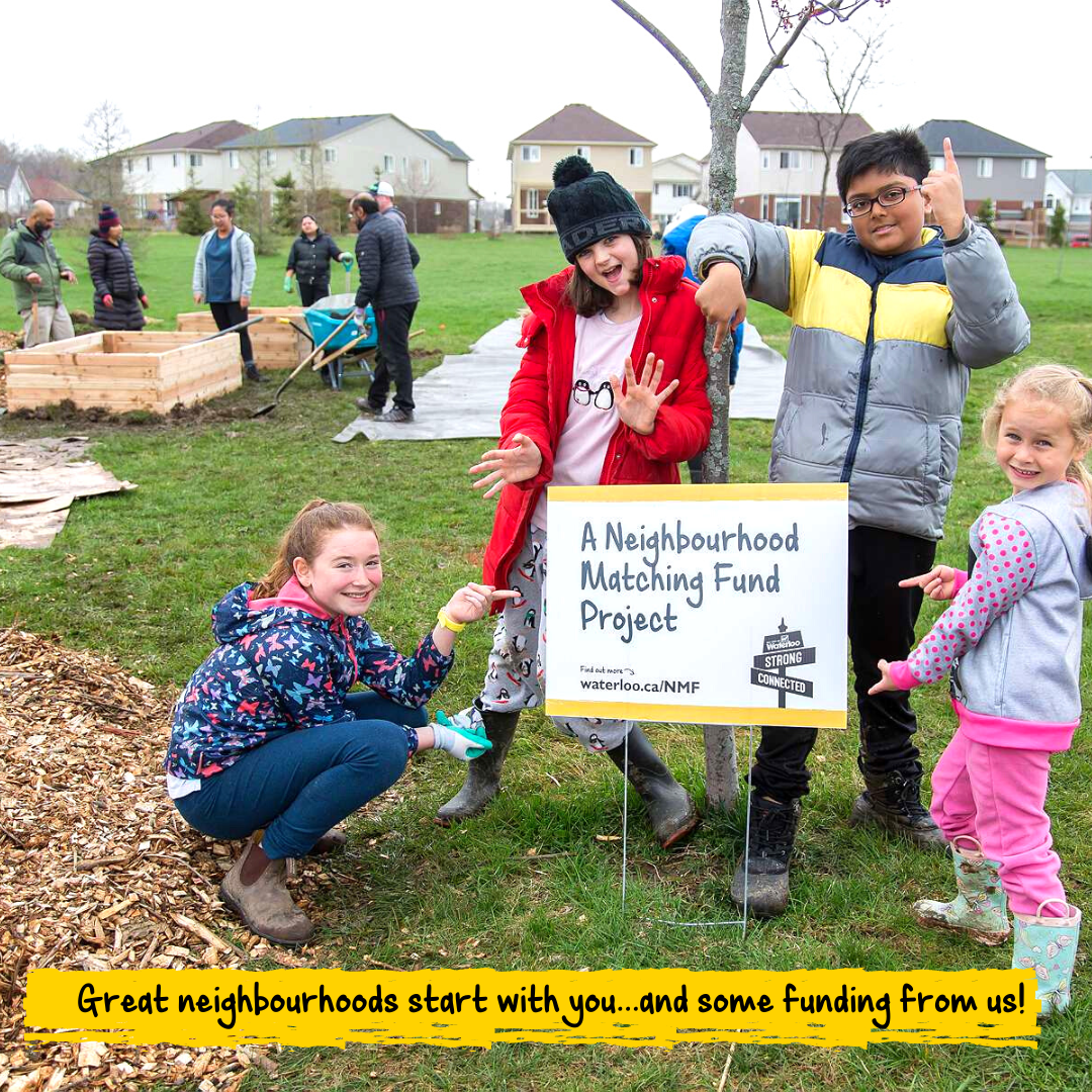 Young kids standing around a sign that reads Neighbourhood Matching Fund project. Text on top reads great neighbourhoods start with you... and funding from us!