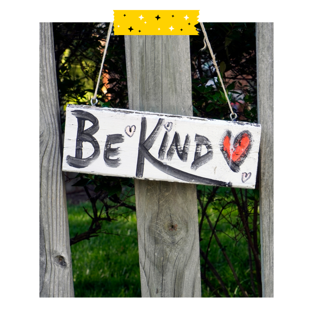Handpainted wooden sign hanging that reads be kind