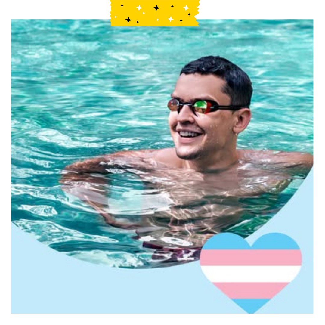 A person in a pool with goggles on and smiling. Blue background with a white pink and blue heart on the right side.