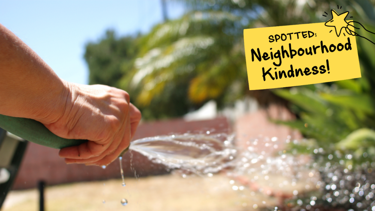 Close up of hand holding a hose watering outside. Text on top reads, spotted neighbourhood kindness