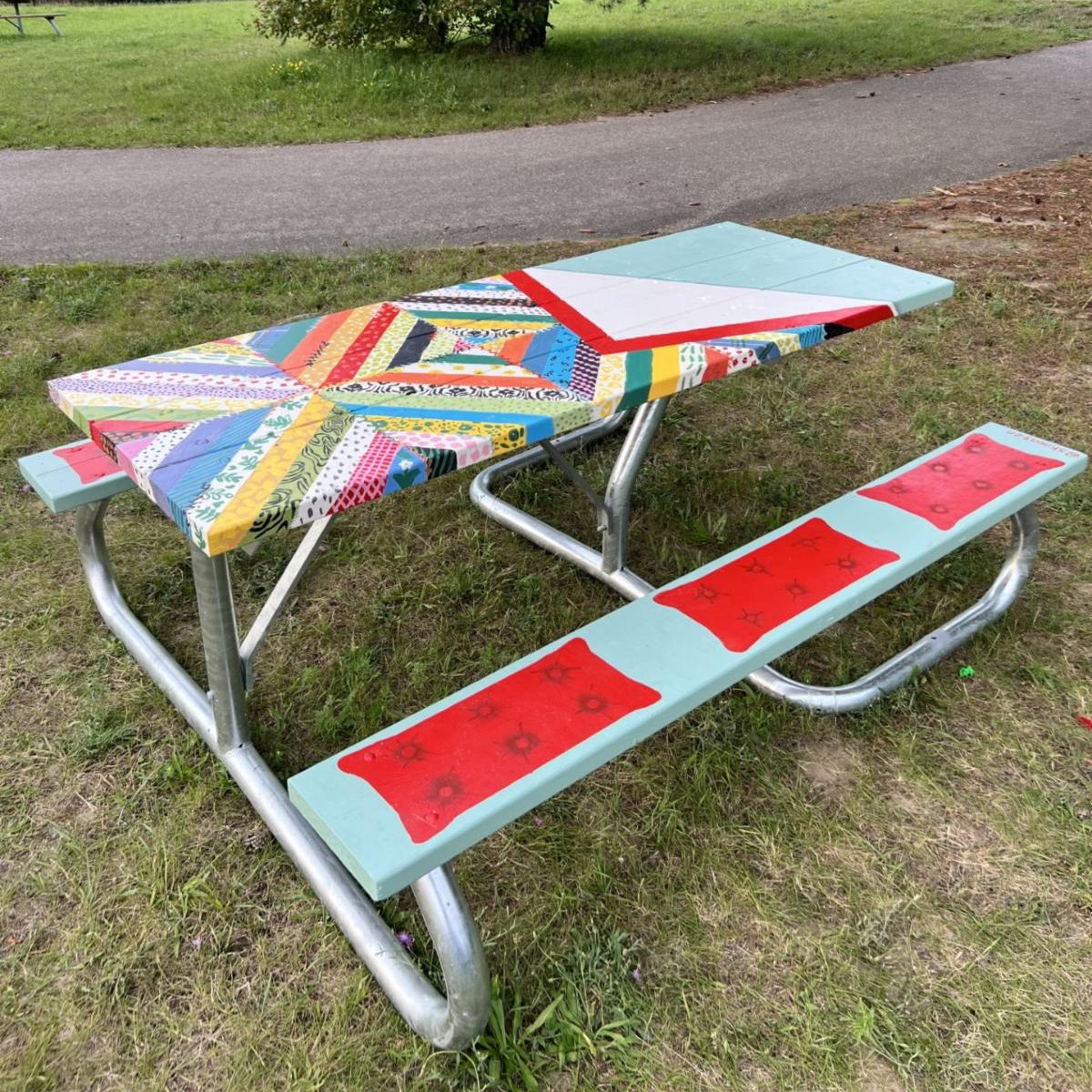 Picnic table painted in bright colours 