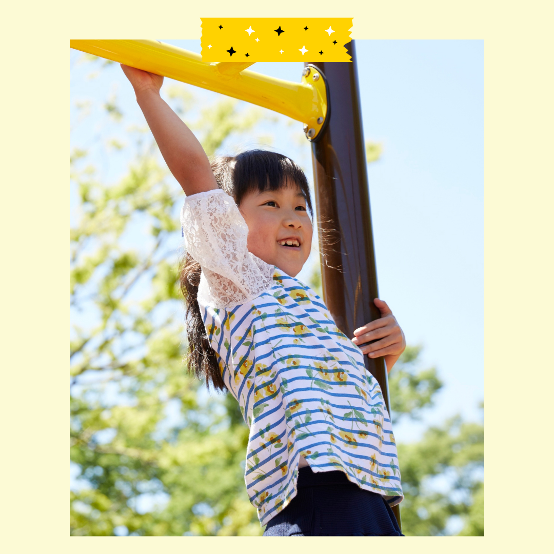 Child playing on monkey bar