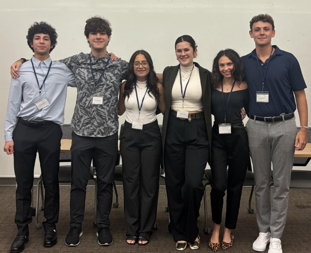 six philosophy students standing with name tags on
