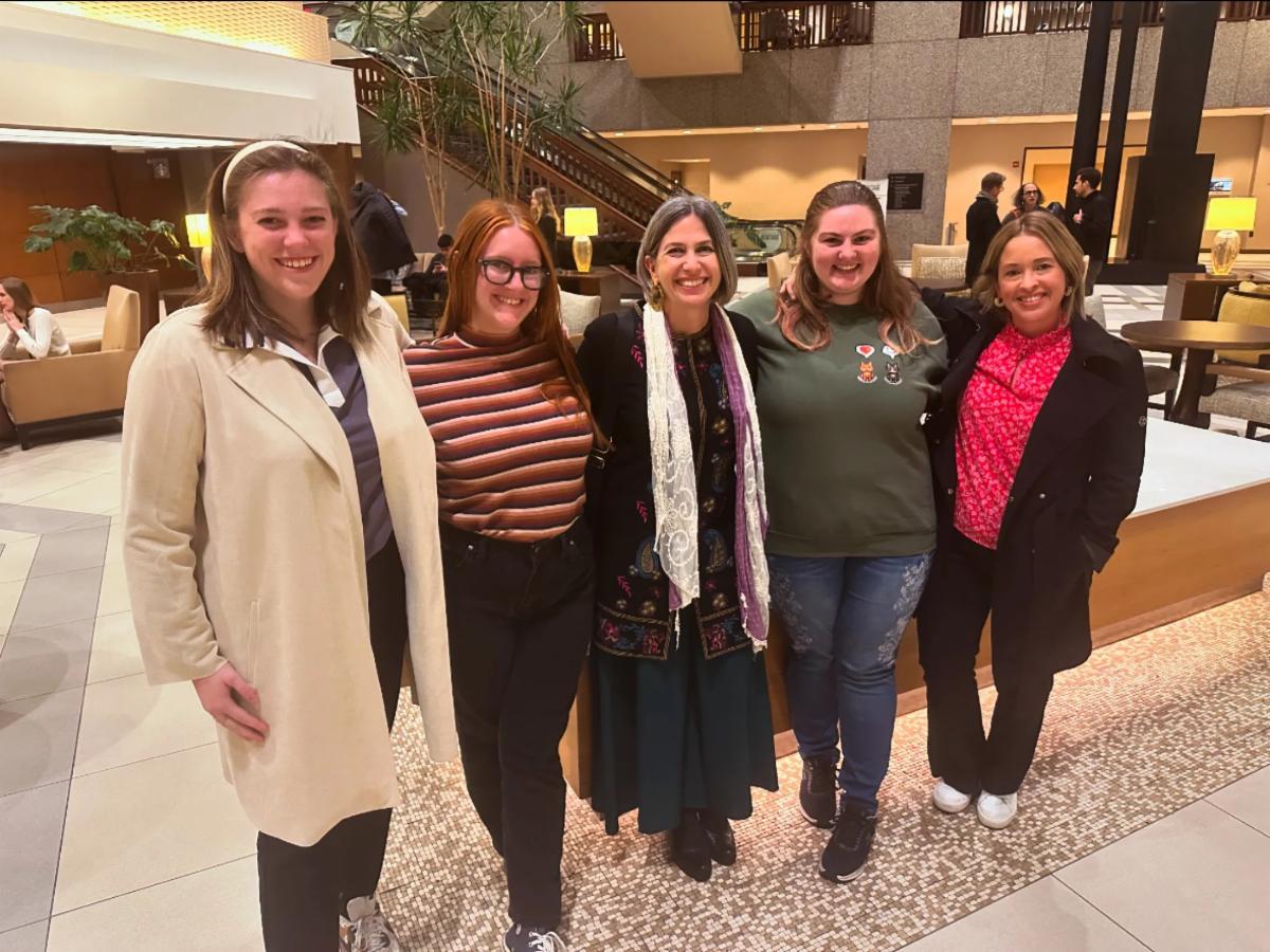 Snapshot of five individuals at an Honors Conference