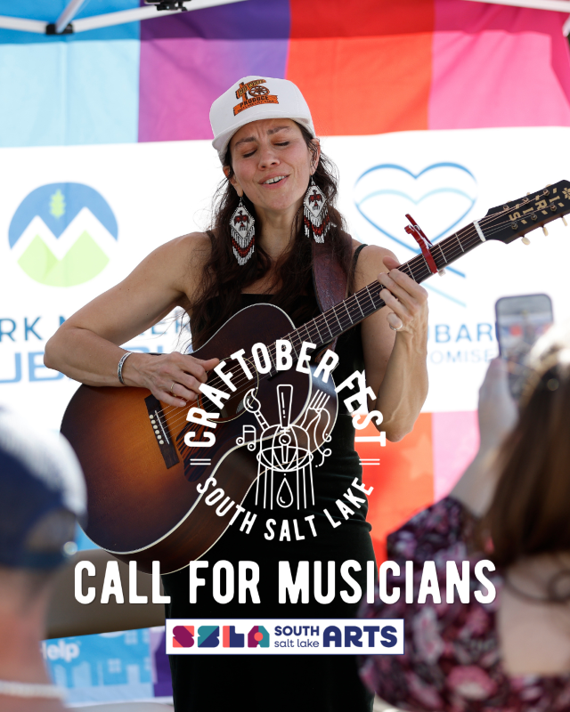 Woman sining and playing guitar at Craftoberfest