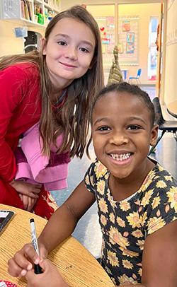 cardinal buddies enjoying making ornaments together during Hanging of the Greens